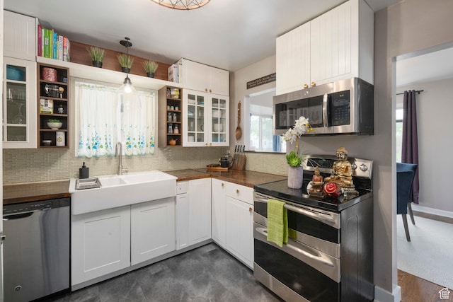 425 N 1300 W, Salt Lake City, UT 84116 - kitchen featuring stainless steel appliances, open shelves, tasteful backsplash, and white cabinets