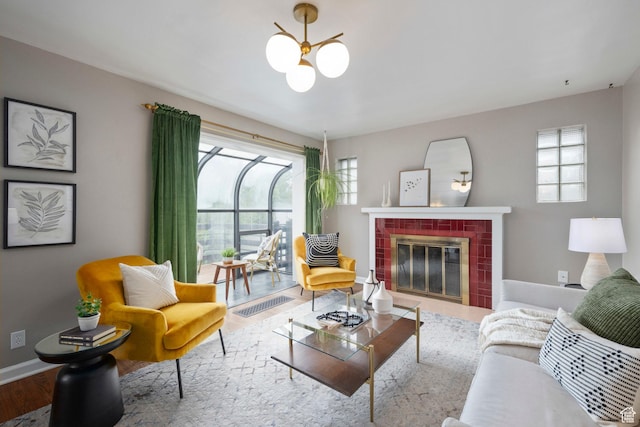 425 N 1300 W, Salt Lake City, UT 84116 - living area with plenty of natural light, a chandelier, wood finished floors, and a brick fireplace