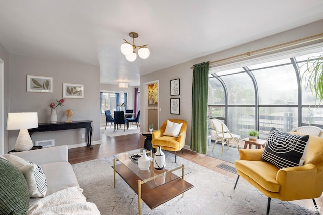 425 N 1300 W, Salt Lake City, UT 84116 - living room with a chandelier, wood finished floors, and baseboards