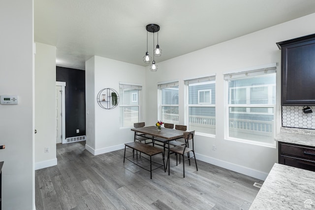 15187 S Sabre Pl, Bluffdale, UT 84065 - dining room with light wood-style flooring and baseboards