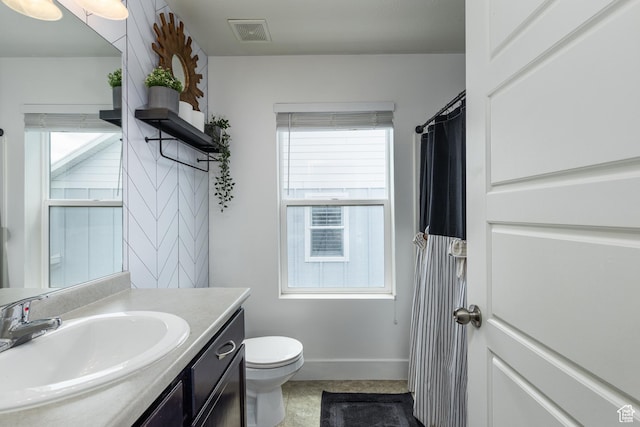 15187 S Sabre Pl, Bluffdale, UT 84065 - bathroom with plenty of natural light, vanity, toilet, and baseboards