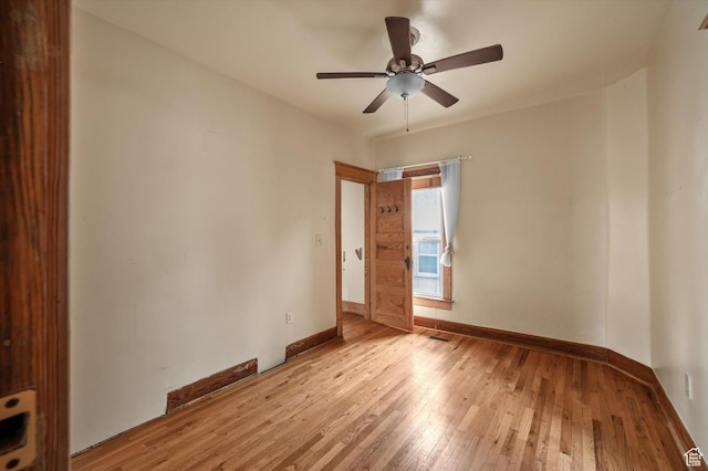 625 S 400 E, Salt Lake City, UT 84111 - empty room with light wood-style flooring, ceiling fan, and baseboards