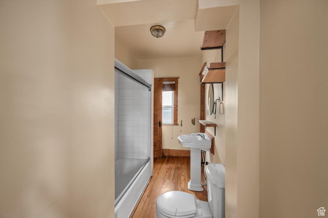 625 S 400 E, Salt Lake City, UT 84111 - full bathroom with wood finished floors, toilet, combined bath / shower with glass door, baseboards, and a sink