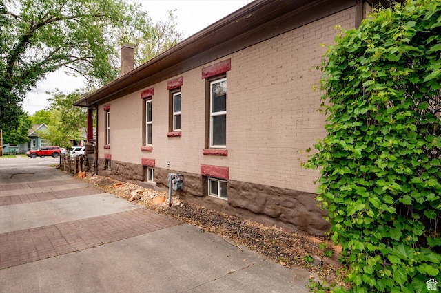 625 S 400 E, Salt Lake City, UT 84111 - view of home's exterior with a chimney and brick siding