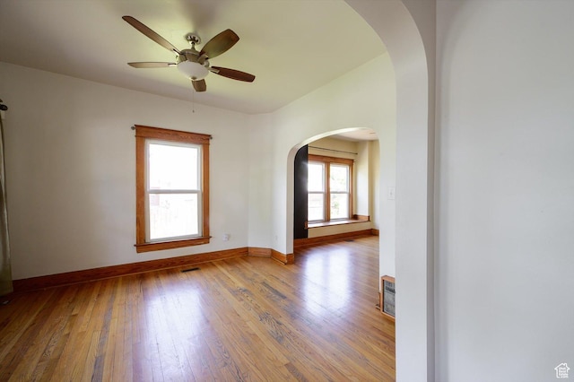 625 S 400 E, Salt Lake City, UT 84111 - empty room featuring arched walkways, hardwood / wood-style flooring, baseboards, and ceiling fan