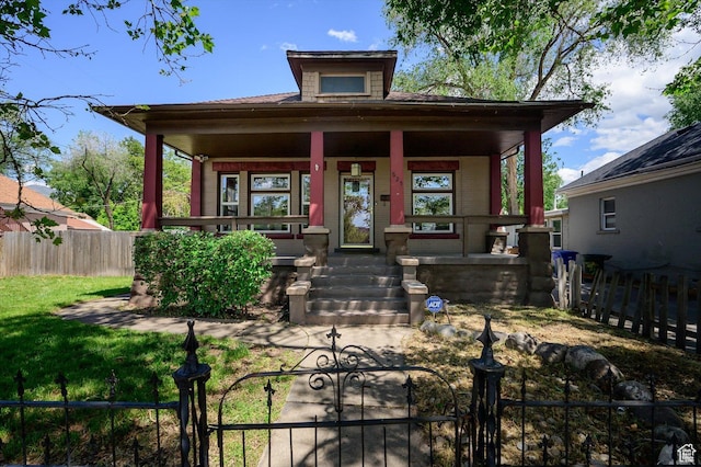 625 S 400 E, Salt Lake City, UT 84111 - view of front of house featuring a porch, a fenced front yard, and a gate