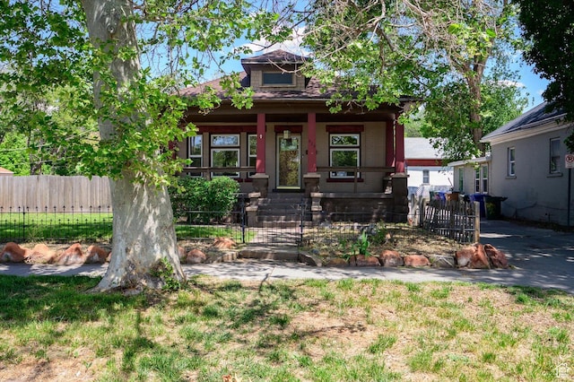 625 S 400 E, Salt Lake City, UT 84111 - view of front of house featuring a porch and a fenced front yard