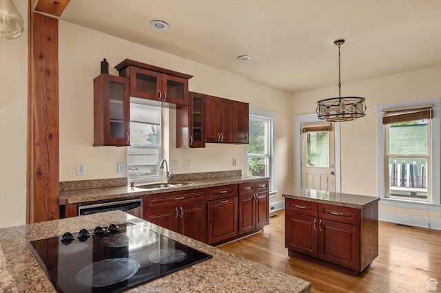 625 S 400 E, Salt Lake City, UT 84111 - kitchen with black electric cooktop, a sink, light wood-style floors, dishwasher, and decorative light fixtures