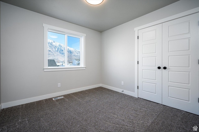 1244 N 350 W Unit 35, Brigham City, UT 84302 - unfurnished bedroom featuring dark colored carpet and a closet