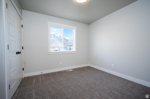 1244 N 350 W Unit 35, Brigham City, UT 84302 - empty room featuring dark colored carpet and baseboards