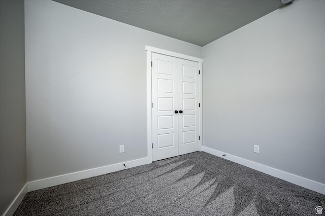 1244 N 350 W Unit 35, Brigham City, UT 84302 - spare room with dark colored carpet and baseboards