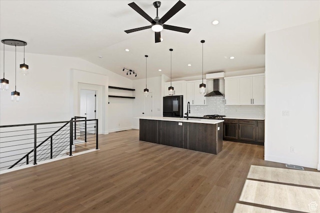 1568 Hudson St Unit 1, Ogden, UT 84404 - kitchen with wall chimney exhaust hood, a sink, ceiling fan, tasteful backsplash, and light countertops