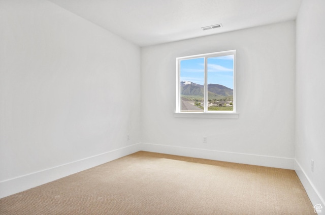 1323 E 370 S, Payson, UT 84651 - spare room featuring light colored carpet, baseboards, and a mountain view