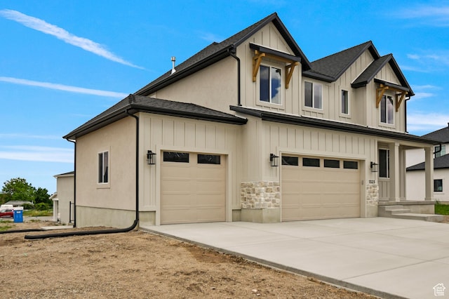 1323 E 370 S, Payson, UT 84651 - view of front of property with board and batten siding, an attached garage, concrete driveway, and stone siding