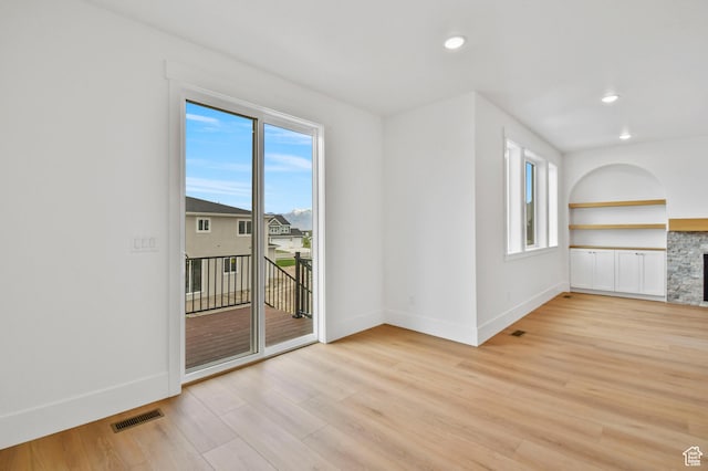 1323 E 370 S, Payson, UT 84651 - unfurnished living room with baseboards, light wood finished floors, recessed lighting, built in features, and a fireplace