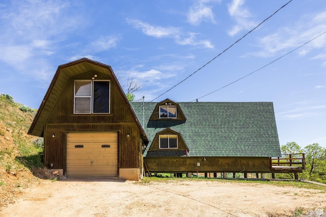 350 Luzern Rd E, Midway, UT 84049 - a-frame home featuring a shingled roof, driveway, a detached garage, and a gambrel roof