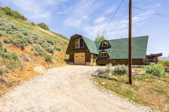 350 Luzern Rd E, Midway, UT 84049 - view of front of house with driveway, a barn, and an outbuilding