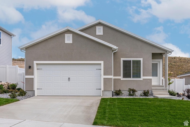 7164 Oquirrh Ranch Pkwy N, Eagle Mountain, UT 84005 - view of front of home with concrete driveway, stucco siding, and a garage