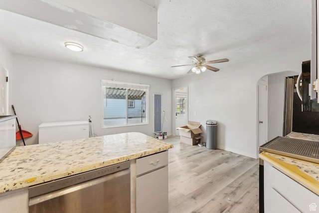 142 N Pinehurst Ave, Tooele, UT 84074 - kitchen featuring dishwasher, ceiling fan, light wood finished floors, light countertops, and baseboards