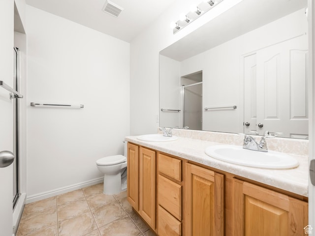 94 N 2830 W, Provo, UT 84601 - bathroom featuring a shower stall, double vanity, toilet, tile patterned flooring, and baseboards