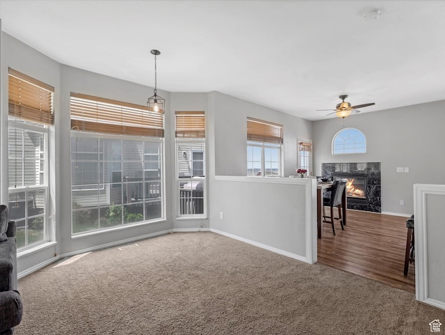 955 E Senior Band, Draper, UT 84020 - unfurnished living room with carpet, ceiling fan, baseboards, and a high end fireplace