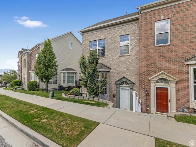955 E Senior Band, Draper, UT 84020 - townhome / multi-family property with brick siding and a front lawn