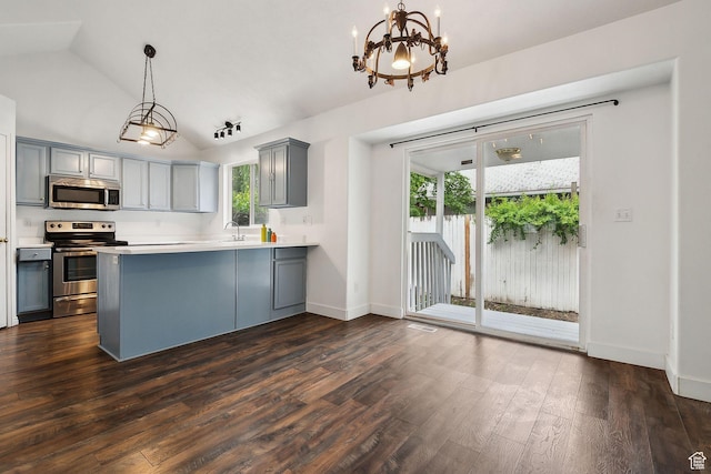 3018 S Leland Cv, South Salt Lake, UT 84106 - kitchen with appliances with stainless steel finishes, gray cabinets, dark wood-type flooring, a sink, and vaulted ceiling