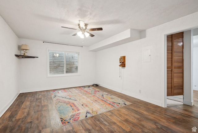 3018 S Leland Cv, South Salt Lake, UT 84106 - empty room featuring ceiling fan, wood finished floors, baseboards, and a textured ceiling