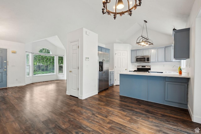 3018 S Leland Cv, South Salt Lake, UT 84106 - kitchen featuring appliances with stainless steel finishes, a sink, a peninsula, a chandelier, and gray cabinets