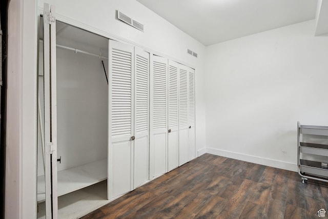 3018 S Leland Cv, South Salt Lake, UT 84106 - unfurnished bedroom with a closet, dark wood finished floors, and baseboards