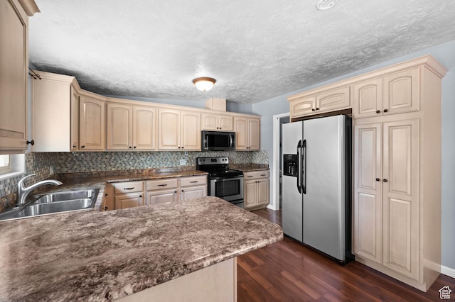 4314 S 615 E, Millcreek, UT 84107 - kitchen with appliances with stainless steel finishes, a sink, cream cabinets, dark wood-type flooring, and a textured ceiling