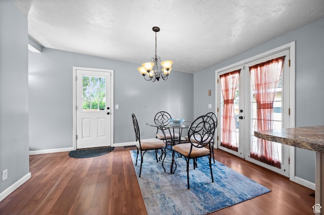 4314 S 615 E, Millcreek, UT 84107 - dining room featuring wood finished floors, baseboards, and a chandelier
