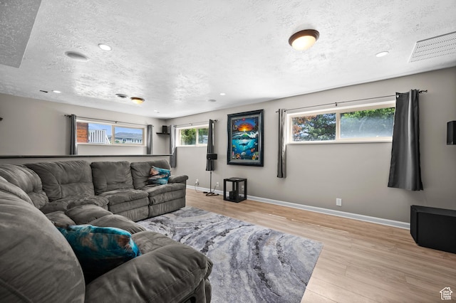 4314 S 615 E, Millcreek, UT 84107 - living area featuring wood finished floors, a textured ceiling, baseboards, and recessed lighting