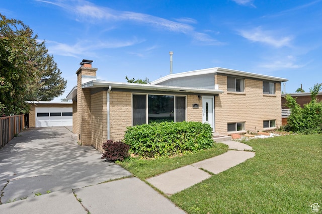 4314 S 615 E, Millcreek, UT 84107 - split level home with a chimney, a front lawn, an outbuilding, and brick siding