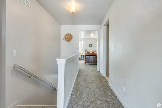 1460 E Lowe Peak Dr, Eagle Mountain, UT 84005 - corridor with an upstairs landing, light colored carpet, and baseboards