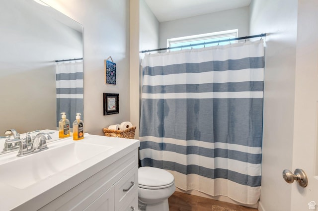 1460 E Lowe Peak Dr, Eagle Mountain, UT 84005 - full bathroom with toilet, vanity, wood finished floors, and a shower with shower curtain