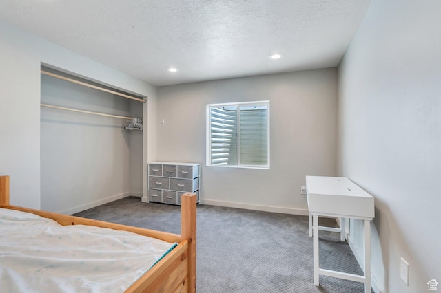 1460 E Lowe Peak Dr, Eagle Mountain, UT 84005 - unfurnished bedroom featuring carpet floors, a textured ceiling, baseboards, recessed lighting, and a closet