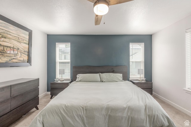 242 E Ridgeline Way N, Salt Lake, UT 84054 - bedroom with light carpet, baseboards, multiple windows, and a textured ceiling