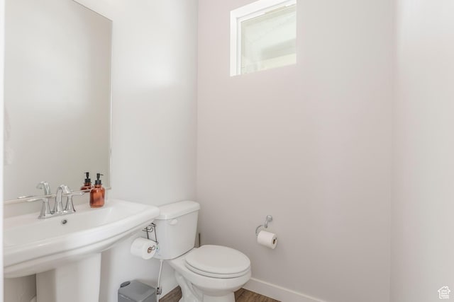 242 E Ridgeline Way N, Salt Lake, UT 84054 - half bathroom with toilet, a sink, and baseboards