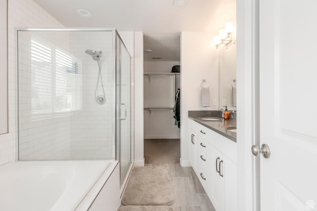 242 E Ridgeline Way N, Salt Lake, UT 84054 - full bath featuring a shower stall, a bath, double vanity, and a walk in closet