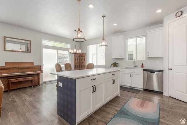 242 E Ridgeline Way N, Salt Lake, UT 84054 - kitchen with dishwasher, a sink, a center island, white cabinetry, and light countertops