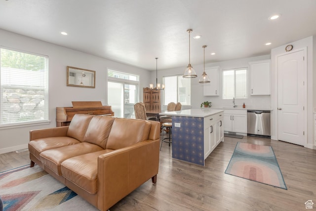 242 E Ridgeline Way N, Salt Lake, UT 84054 - living area featuring recessed lighting, light wood-type flooring, baseboards, and a chandelier