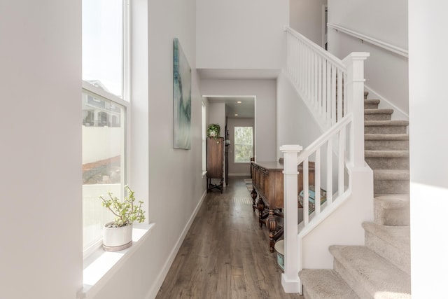 242 E Ridgeline Way N, Salt Lake, UT 84054 - entryway with wood finished floors, a high ceiling, stairway, and baseboards