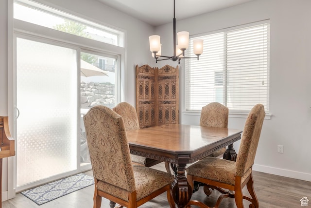 242 E Ridgeline Way N, Salt Lake, UT 84054 - dining space featuring a chandelier, baseboards, and light wood-type flooring
