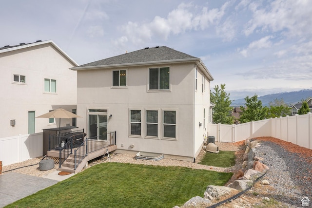 242 E Ridgeline Way N, Salt Lake, UT 84054 - rear view of house featuring a deck with mountain view and stucco siding