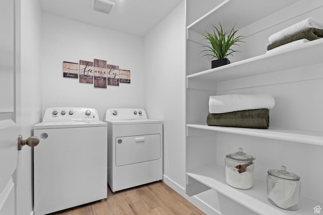 1261 N 375 E Unit 155, Harrisville, UT 84404 - laundry room featuring independent washer and dryer and light wood-type flooring