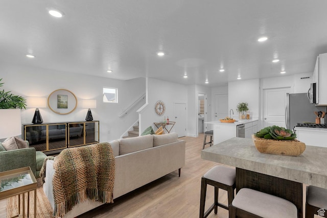1261 N 375 E Unit 155, Harrisville, UT 84404 - living area with stairs, recessed lighting, and light wood-style flooring
