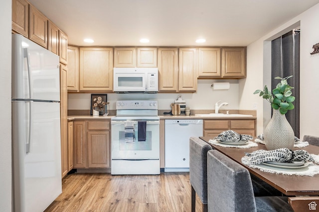 2025 S Canyon Resort Dr Unit F-8, Park City, UT 84098 - kitchen with white appliances, a sink, light brown cabinetry, light wood-style floors, and light countertops