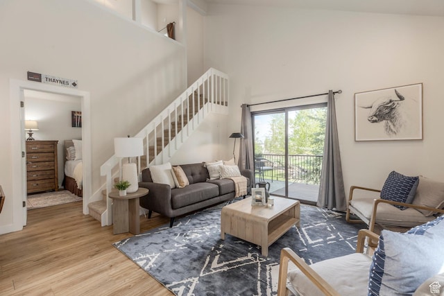 2025 S Canyon Resort Dr Unit F-8, Park City, UT 84098 - living room featuring stairway, wood finished floors, and a high ceiling