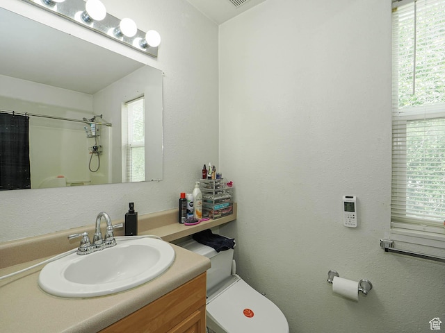 787 W Lennox St S, Midvale, UT 84047 - bathroom featuring toilet, a shower with curtain, and vanity